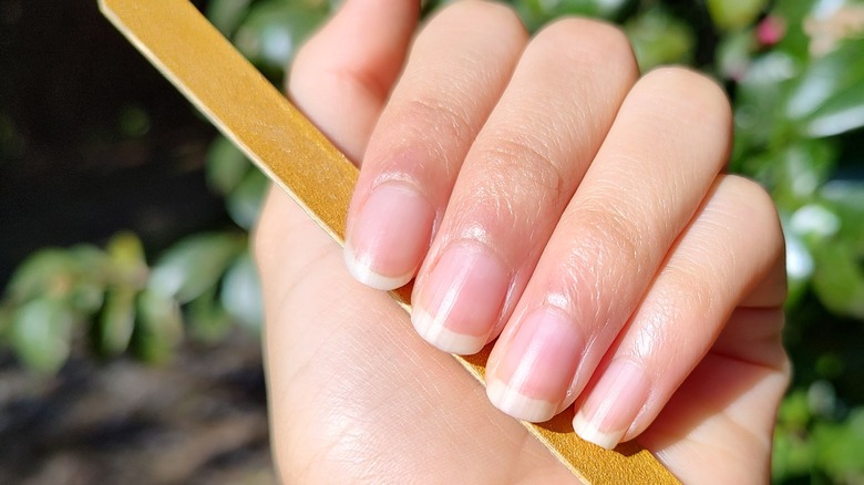 Woman with French manicure