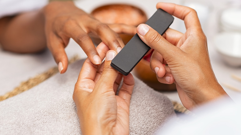 Woman getting nails done