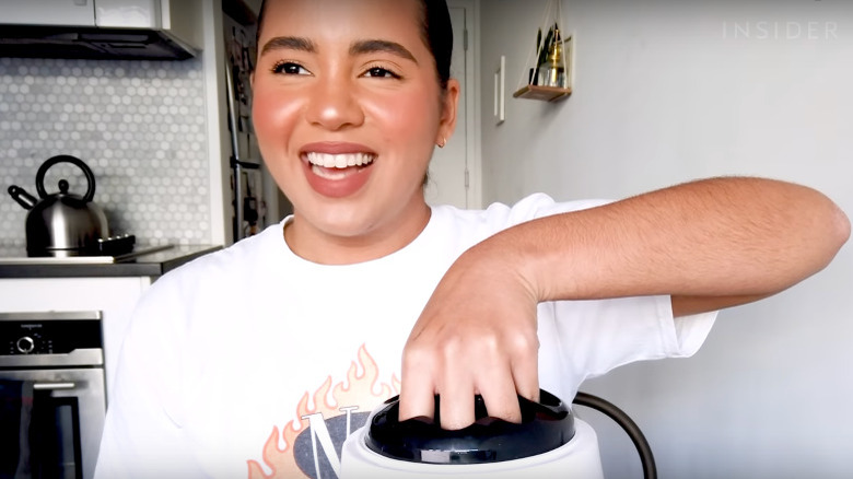 woman trying nail steamer