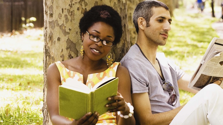 couple reading outside