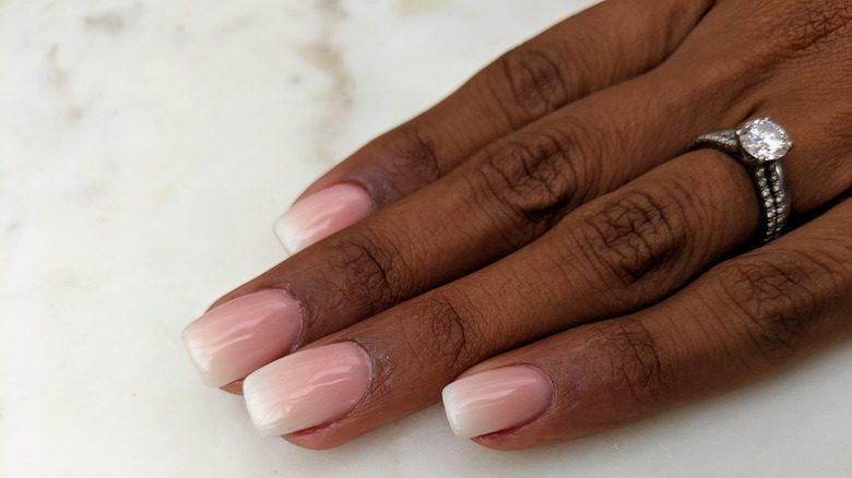 Woman's hand on counter