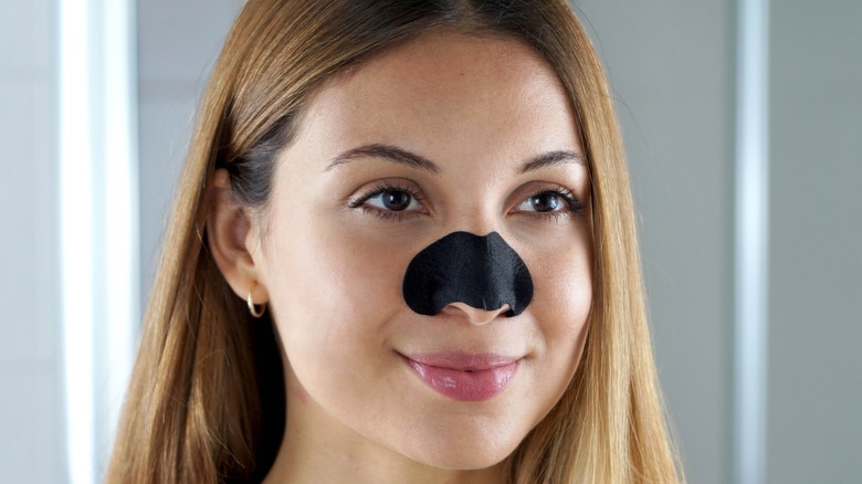 woman with pore strip on nose 