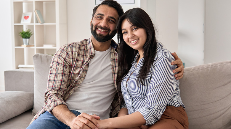 smiling couple holding hands