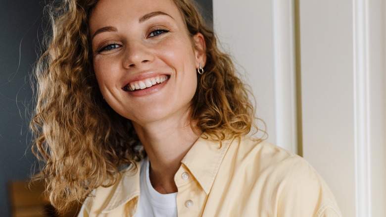 woman blonde curly hair