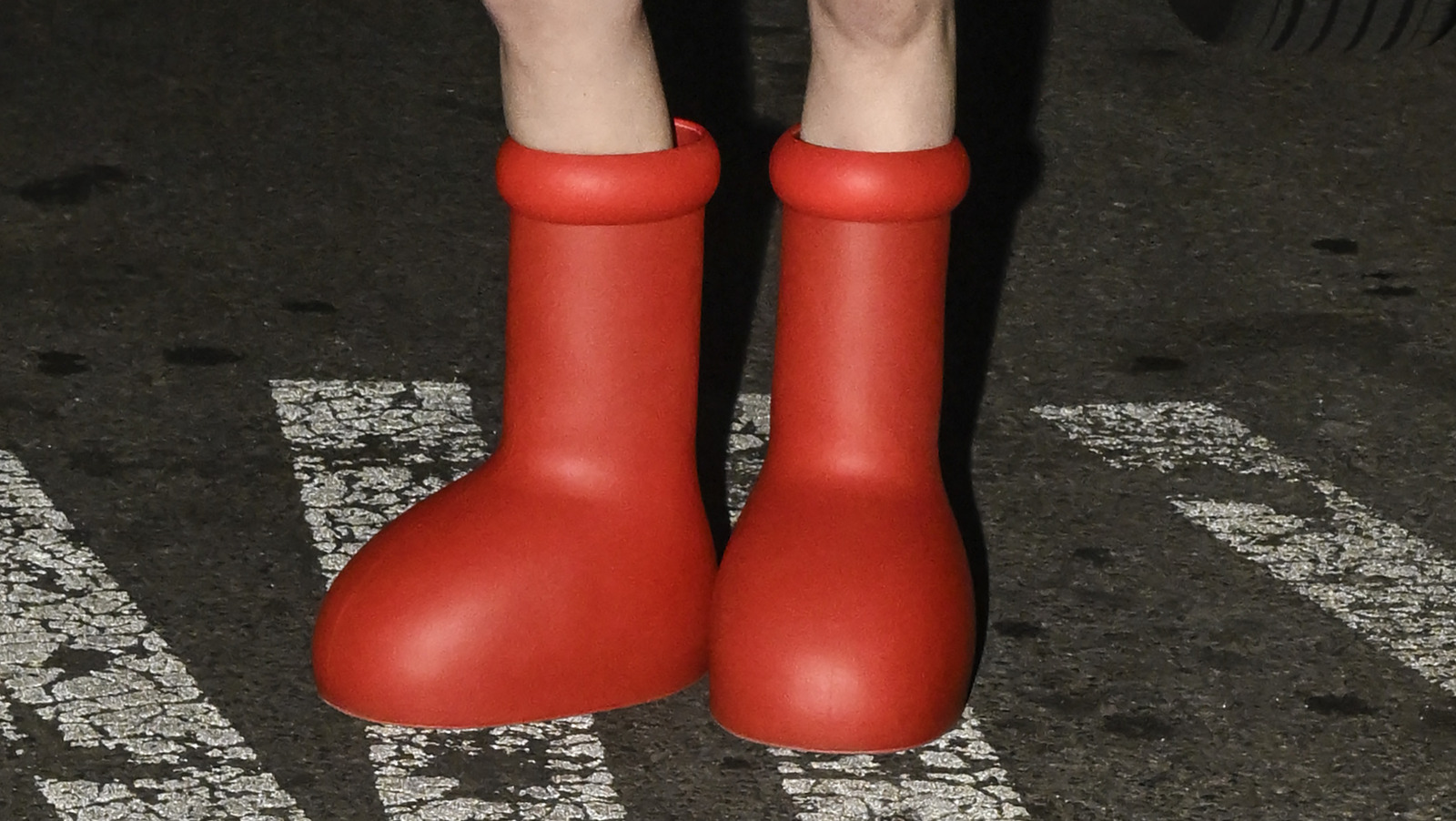What's With Those Cartoonishly Big Red Rubber Boots Influencers Are Showing  Off On Social Media?