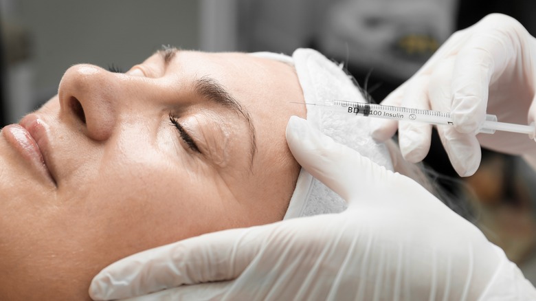 Woman getting botox injections