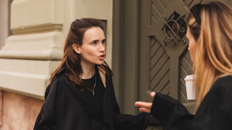 Two women arguing outside