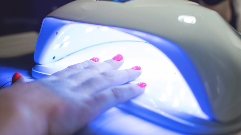 Gel manicure drying under UV 