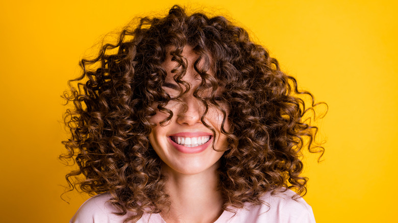 curly-haired woman with healthy hair