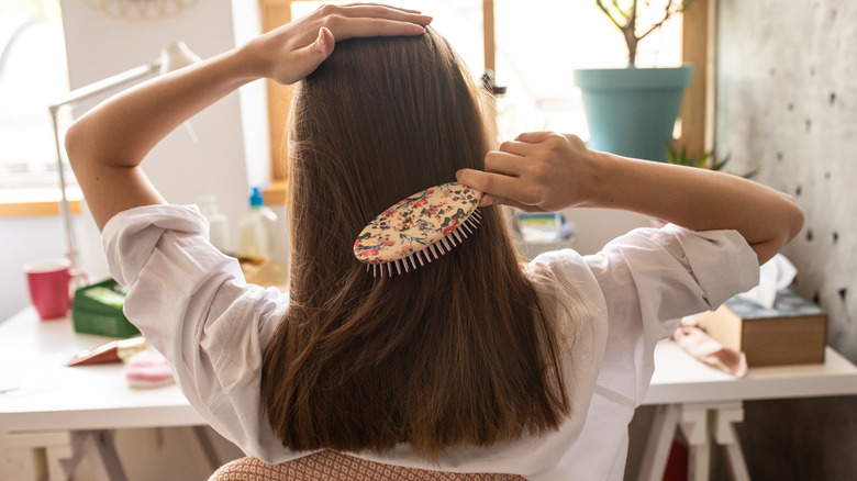 Woman brushing her hair