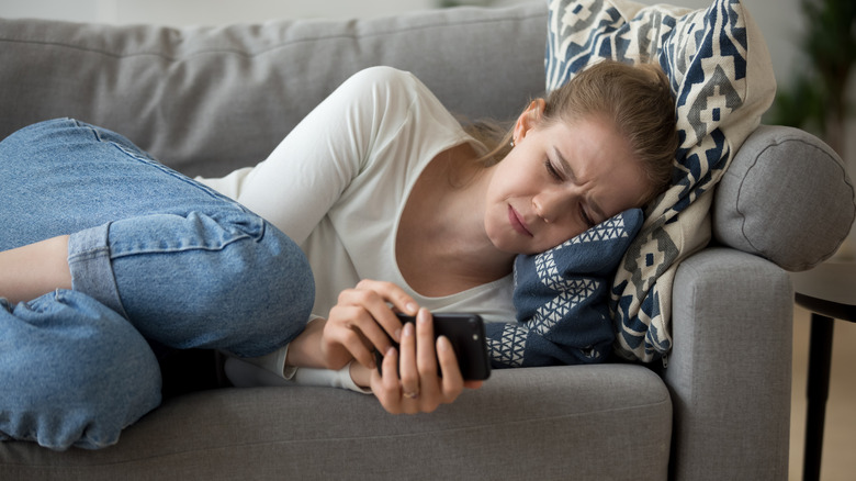 Woman waiting for text message