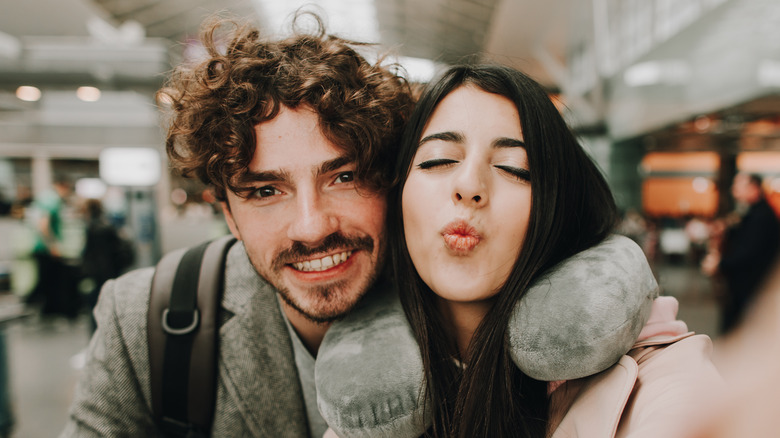 traveling couple taking selfie