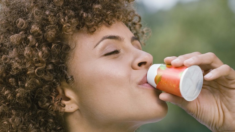 Girl drinking a supplement