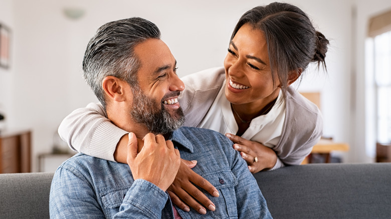 couple hugging on couch