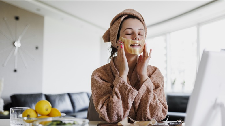 woman applying face mask