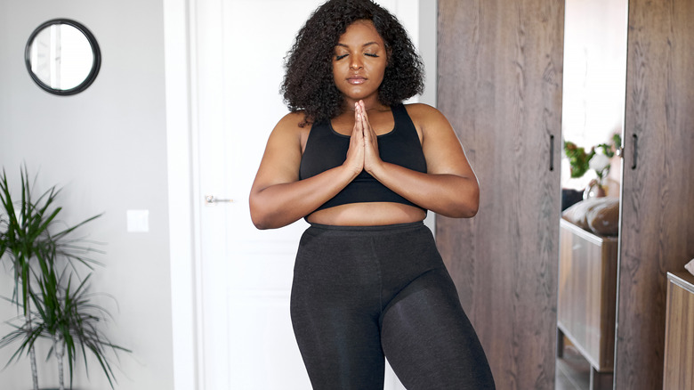 female practicing yoga