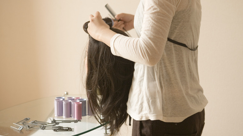 Woman styling wig