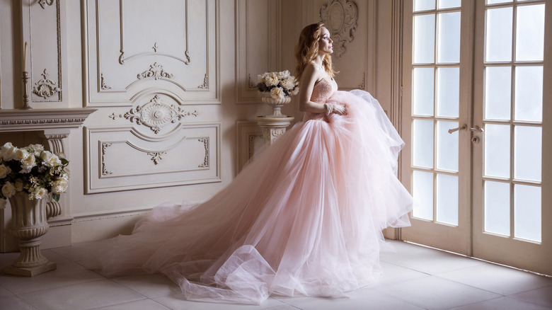 Woman in blush-colored wedding dress