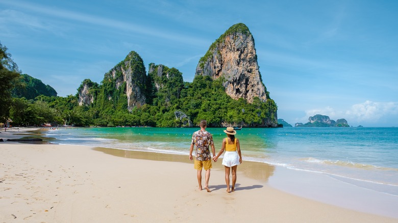 Couple walking on Thailand beach