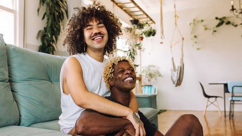 young lgbtq+ couple laughing