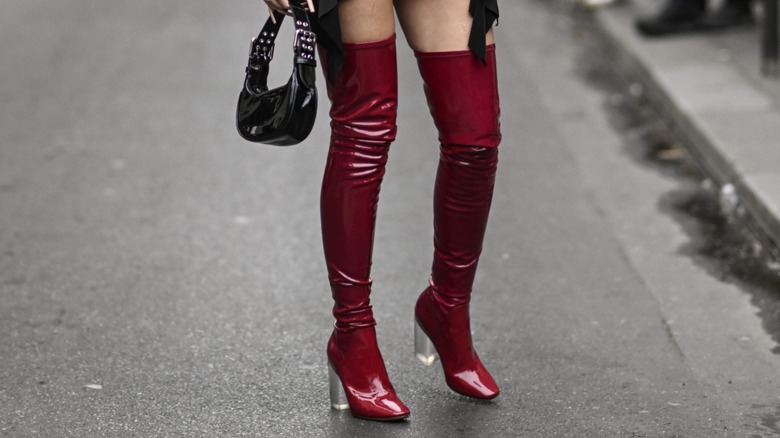 woman wearing burgundy boots