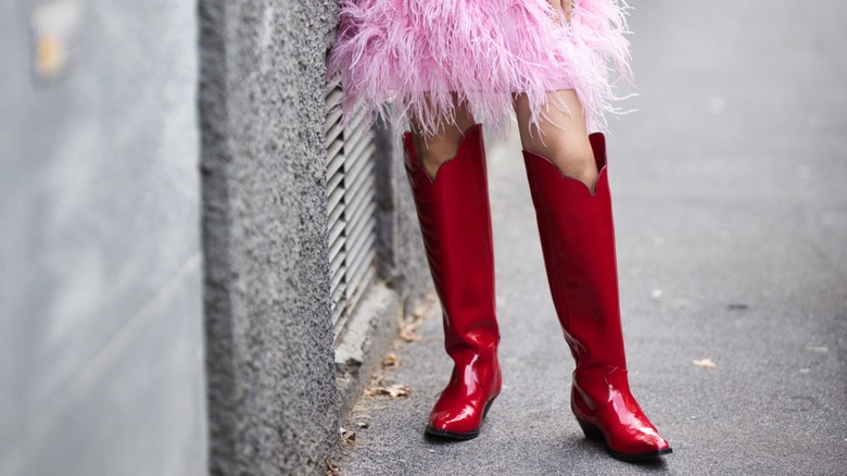 woman wearing red cowboy boots