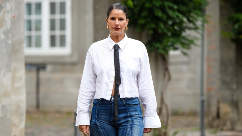 woman wearing cropped white top