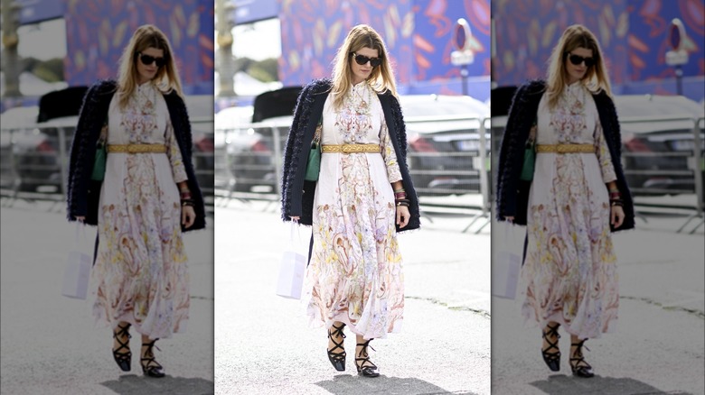 Woman in long white floral dress