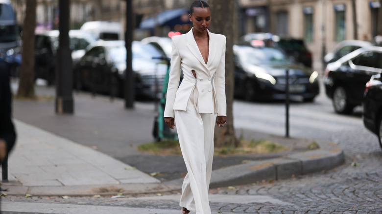 Woman in white pant suit