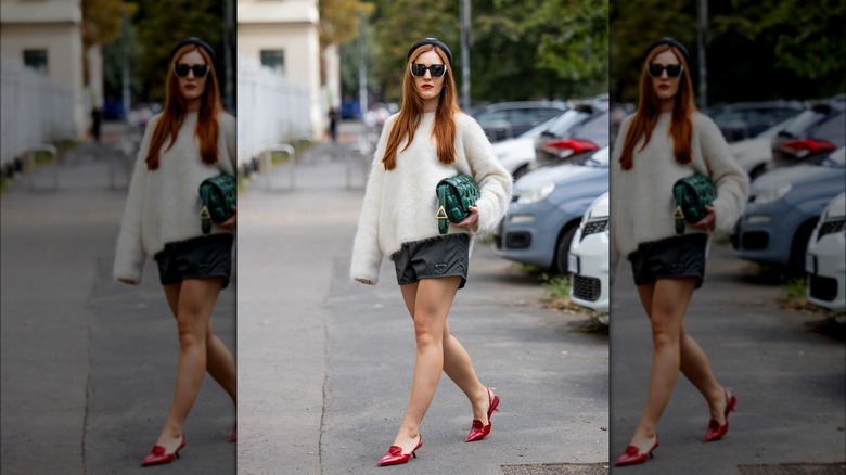 Woman with cashmere white sweater and shorts