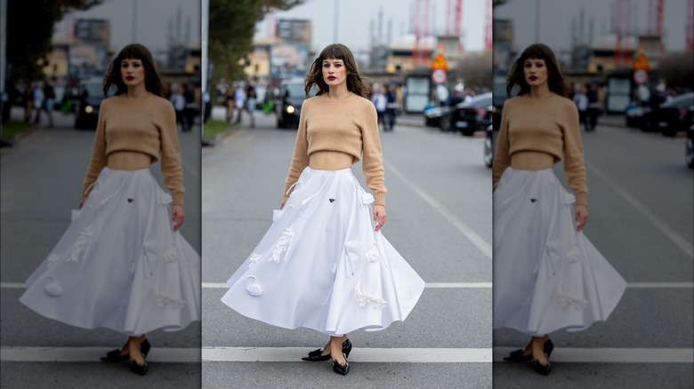 Woman wearing white A-line skirt 