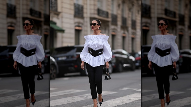 Woman in white ruffled top