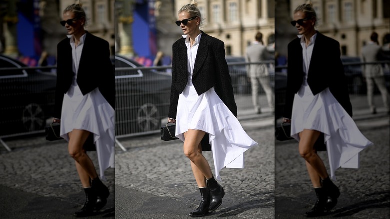 Woman in asymetrical white dress