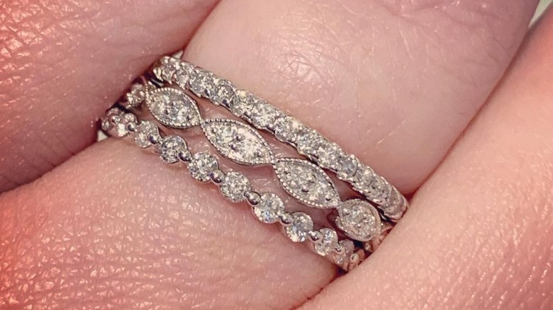 Three stacked white gold rings 