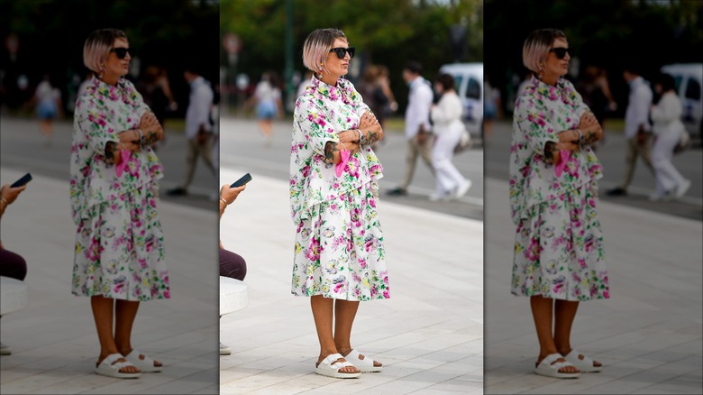 woman wearing white slide sandals