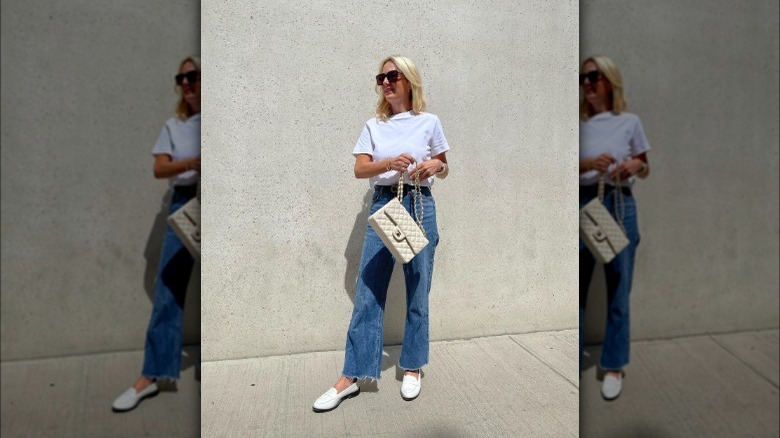 Woman wearing white penny loafers