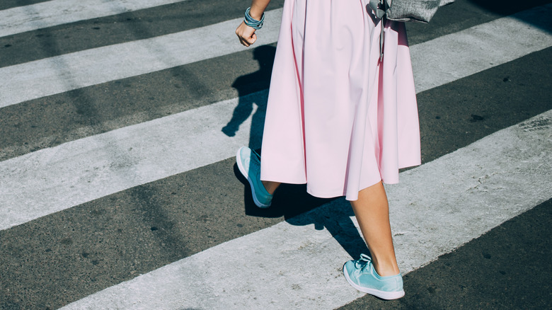 Woman wearing blue sneakers