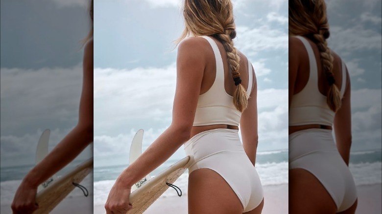 Woman in white two piece swimsuit