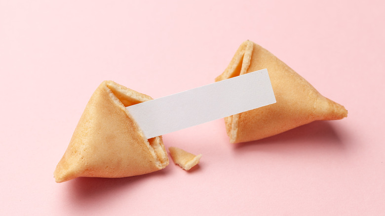 fortune cookie being broken open