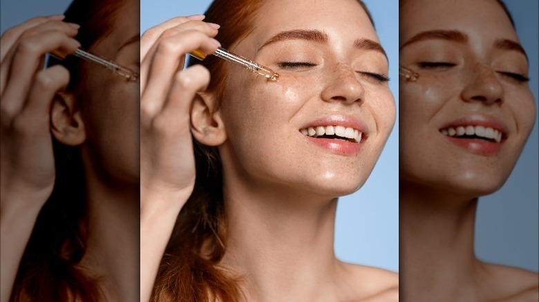 Woman applying serum