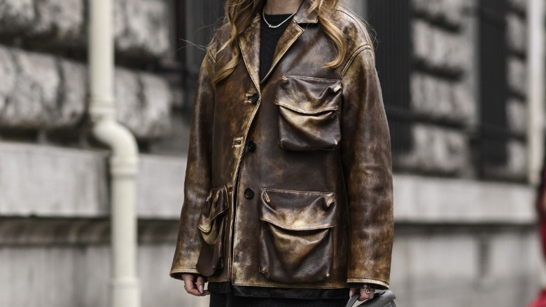 Woman in leather jacket with oversized pockets