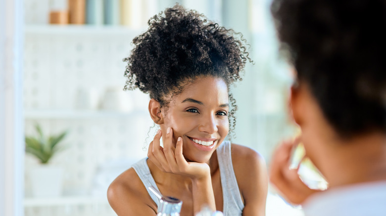 Woman smiling at her reflection