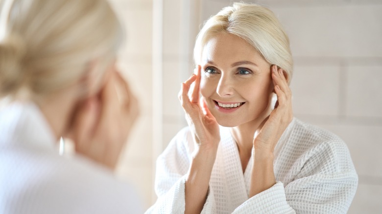 Woman looking in the mirror