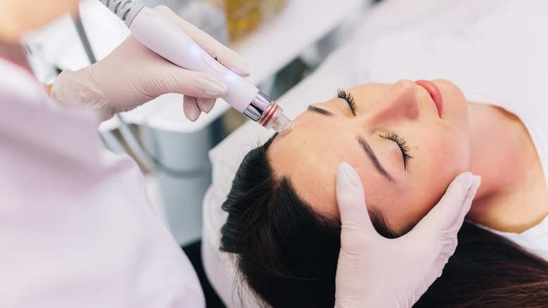 Woman getting an oxygen facial