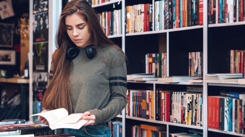 Young woman browsing bookstore