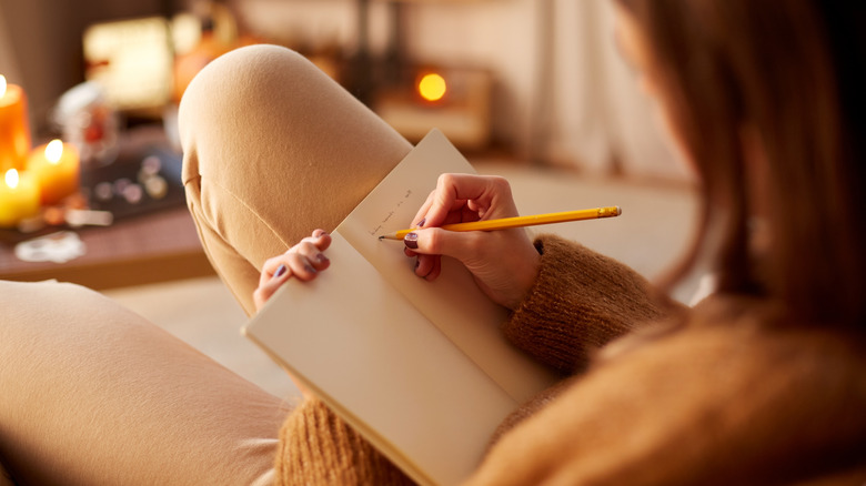 Woman journaling in serene space