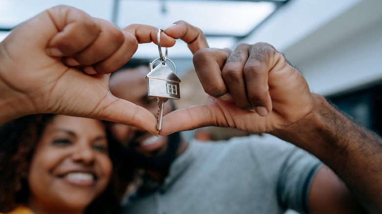 Couple holding a house key