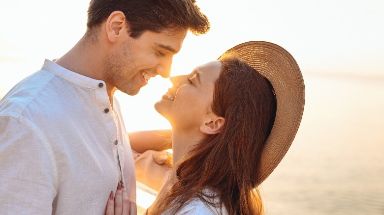 Woman looking up at man