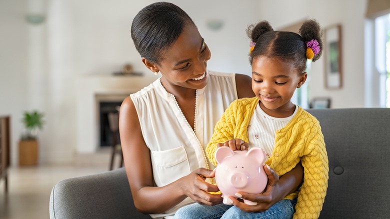 child with piggy bank