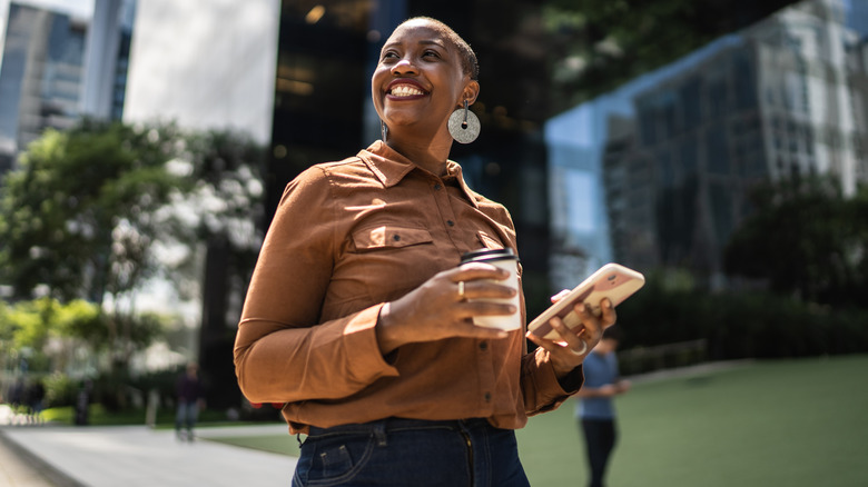 Happy career woman with phone